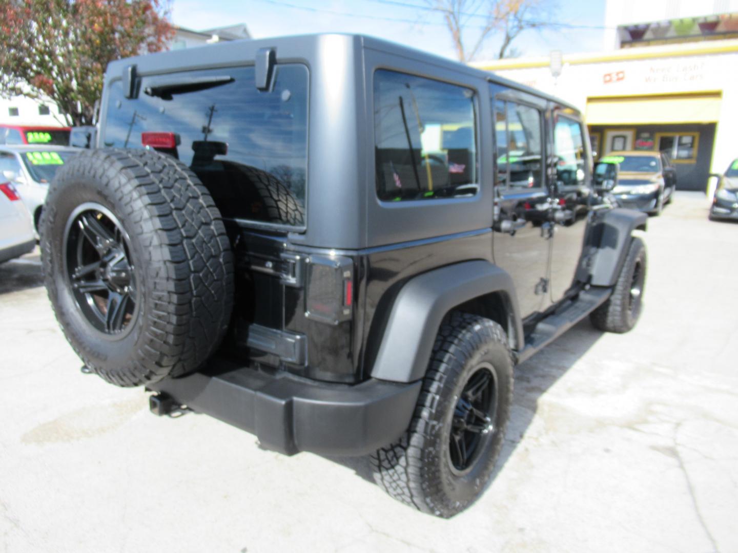 2017 Black /Black Jeep Wrangler UNLIMITED SPORT (1C4BJWDG1HL) with an 3.6L V6 F DOHC 24V engine, Automatic transmission, located at 1511 North Shepherd Dr., Houston, TX, 77008, (281) 657-1221, 29.798361, -95.412560 - 2017 JEEP WRANGLER UNLIMITED SPORT VIN: 1C4BJWDG1HL517754 1 C 4 B J W D G 1 H L 5 1 7 7 5 4 4 DOOR WAGON/SPORT UTILITY 3.6L V6 F DOHC 24V GASOLINE REAR WHEEL DRIVE W/ 4X4 - Photo#26